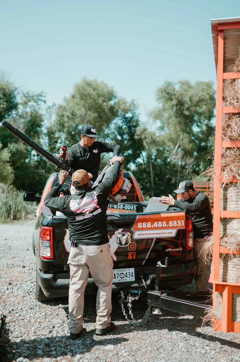 Pinestraw America crew loading a delivery truck